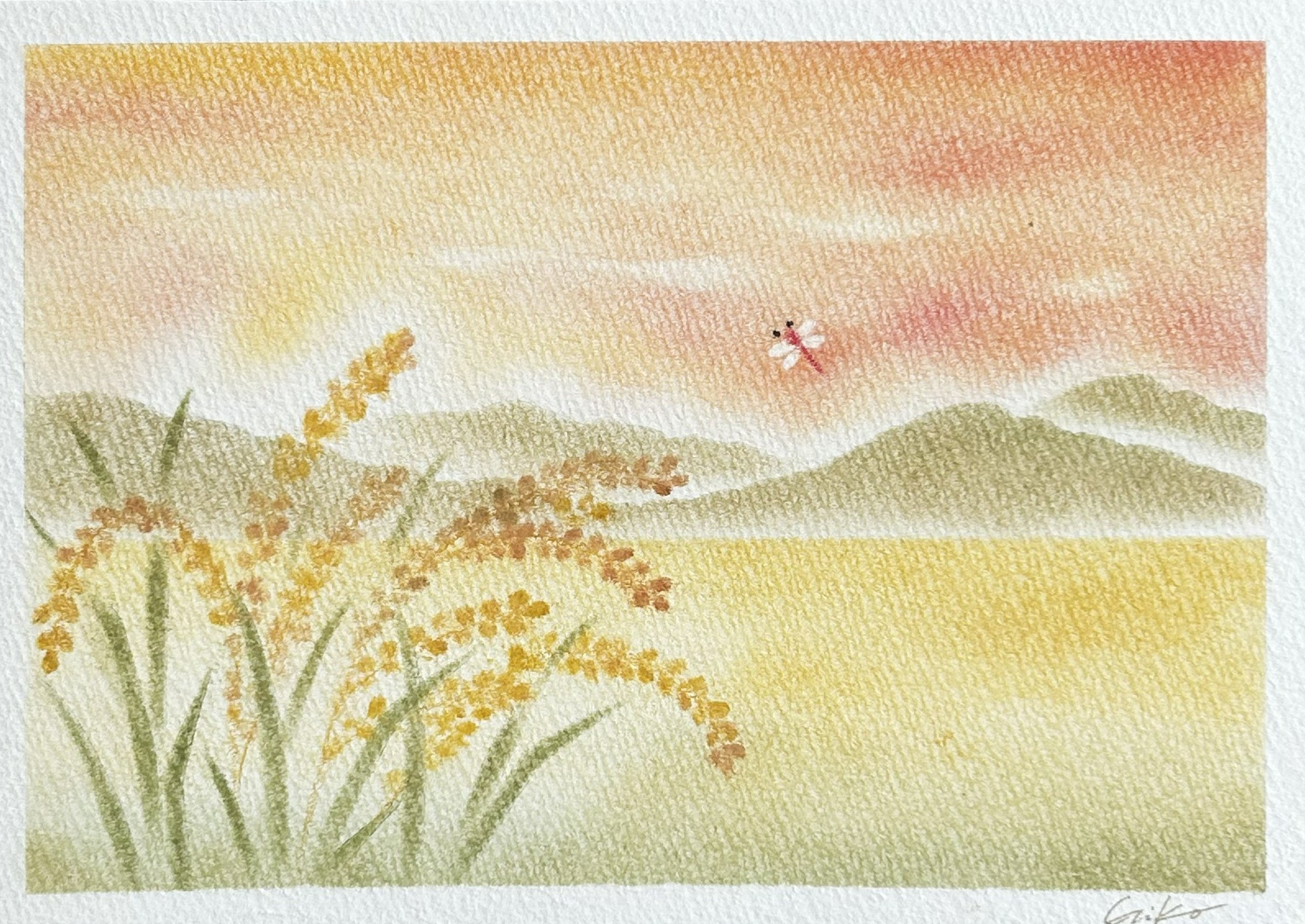 稲穂と夕焼けを描く