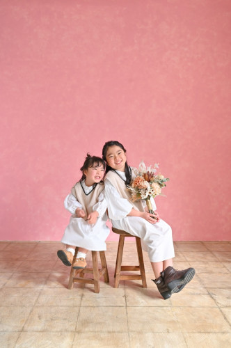 family-photo-sisters-pink-wall.jpg