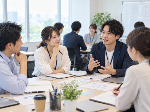 明るい会議室の活発なワークショップ.png