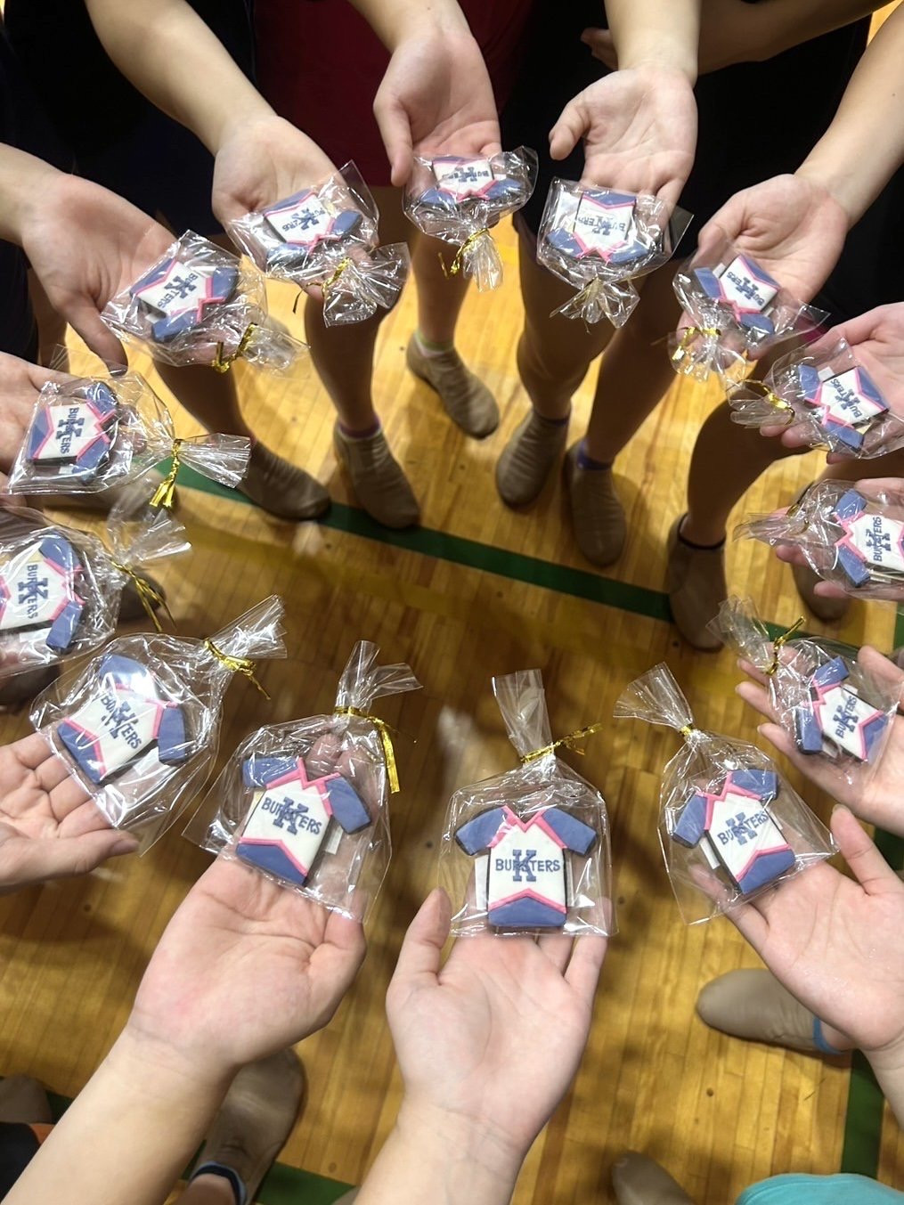 Cheer team icing cookies 