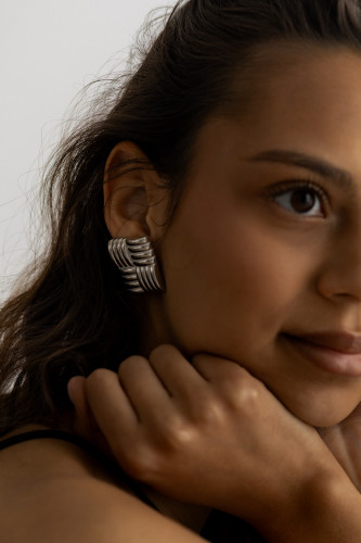 kaboompics_close-up-portrait-of-woman-wearing-silver-statement-earring-39656.jpg
